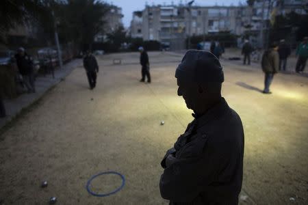 Members of the French community play boules at a club in Netanya, a city of 180,000 on the Mediterranean north of Tel Aviv, that has become the semi-official capital of the French community in Israel January 25, 2015. REUTERS/Ronen Zvulun