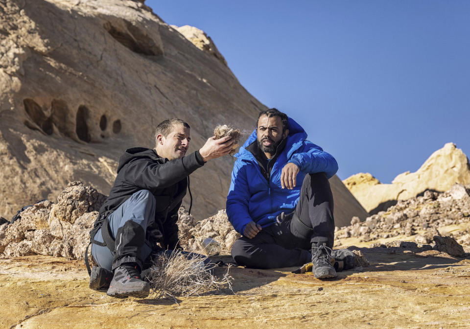 This image released by Nat Geo shows Bear Grylls, left, and Daveed Diggs at Eldorado Canyon, Utah, in a scene from “Running Wild with Bear Grylls: The Challenge," premiering on July 9. (Ben Simms/Nat Geo via AP)