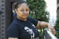 In this Sept. 26, 2021, photo Krystal Archie poses for a portrait in Chicago. Her children were just 7, 11 and 14 years old when on two occasions, only 11 weeks apart, police kicked open the front door of her home on Chicago's South Side and ordered them to get down on the floor. (AP Photo/Teresa Crawford)