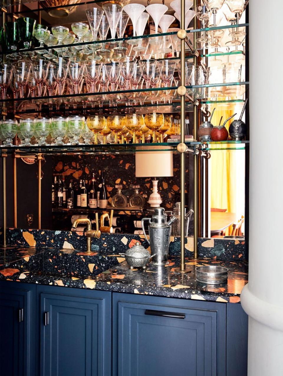 a kitchen with many glass shelves