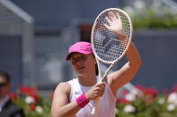 Iga Swiatek of Poland reacts after defeating Sara Sorribes of Spain during the Mutua Madrid Open tennis tournament in Madrid, Spain, Monday, April 29, 2024. (AP Photo/Manu Fernandez)