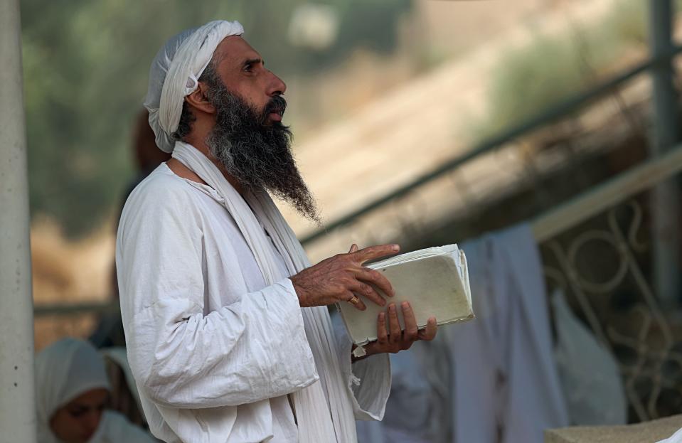 In this Sunday, Oct. 14, 2018 photo, followers of the obscure and ancient Mandaean faith performs rituals along a strip of embankment on the Tigris River reserved for them, in Baghdad, Iraq. Until 2003, nearly all the world’s Mandaeans lived in Iraq, but the cycles of conflict since the U.S. invasion have driven minorities out of the country for security reasons and economic opportunity. (AP Photo/Hadi Mizban)