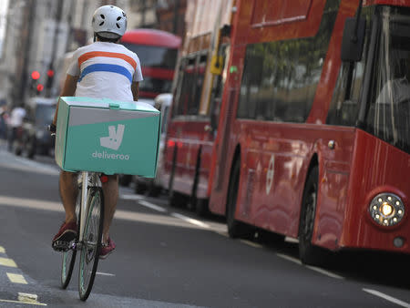 FILE PHOTO: A cyclist delivers food for Deliveroo in London, Britain, September 15, 2016. REUTERS/Toby Melville/File Photo