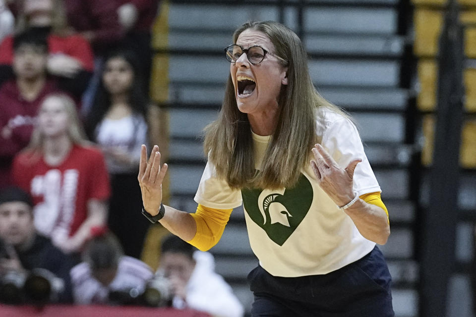 Michigan coach Kim Barnes Arico shouts during the first half of the team's NCAA college basketball game against Indiana, Thursday, Feb. 16, 2023, in Bloomington, Ind. (AP Photo/Darron Cummings)
