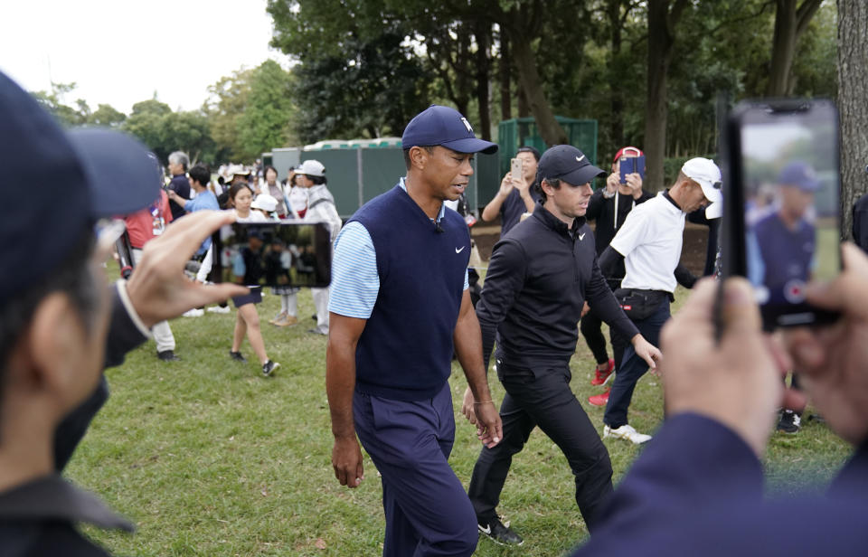 Tiger Woods of the United States, center left, and Rory McIlroy of Northern Ireland, center right, walk during the Challenge: Japan Skins event ahead of the Zozo Championship PGA Tour at Accordia Golf Narashino C.C. in Inzai, east of Tokyo, Monday, Oct. 21, 2019. (AP Photo/Lee Jin-man)