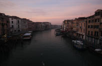 A view of the Canal Grande or Grand Canal, in Venice, Italy, Saturday, Jan. 30, 2021. The canal city's Carnival festivities should have started Saturday, but the COVID-19 pandemic made the annual appointment for more than two weeks of merry-making impossible. (AP Photo/Antonio Calanni)