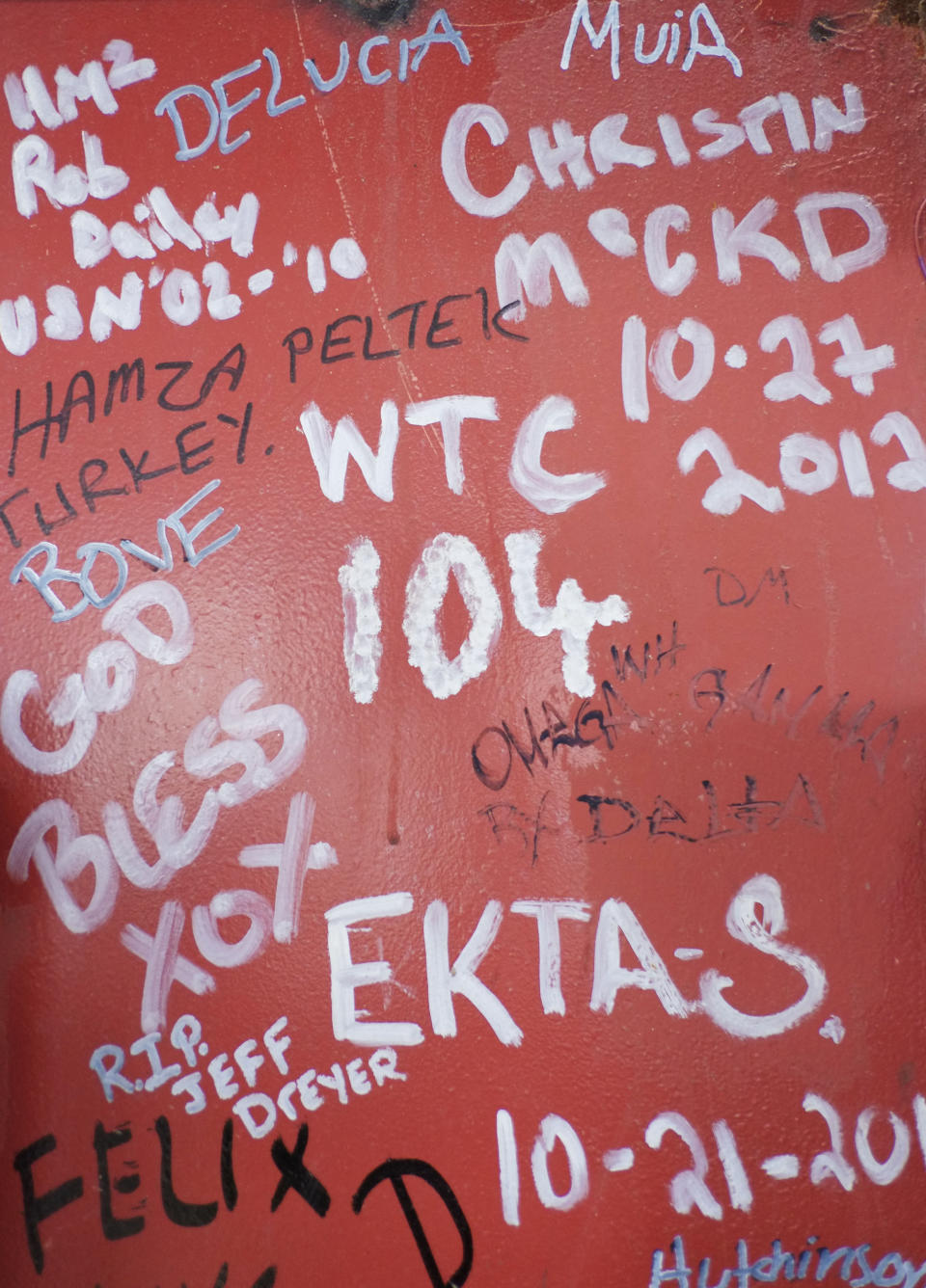 This Jan. 15, 2013 photo shows graffiti left by workers on a steel column on the 104th floor of One World Trade Center in New York. Construction workers finishing New York's tallest building at the World Trade Center are leaving their personal marks on the concrete and steel in the form of graffiti. (AP Photo/Mark Lennihan)