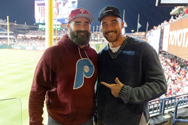 <p>Gabriella Ricciardi/MLB Photos via Getty</p> Jason and Travis Kelce pose for a photo during Game 1 of the NLCS between the Arizona Diamondbacks and the Philadelphia Phillies at Citizens Bank Park on Monday, October 16, 2023 in Philadelphia, Pennsylvania.