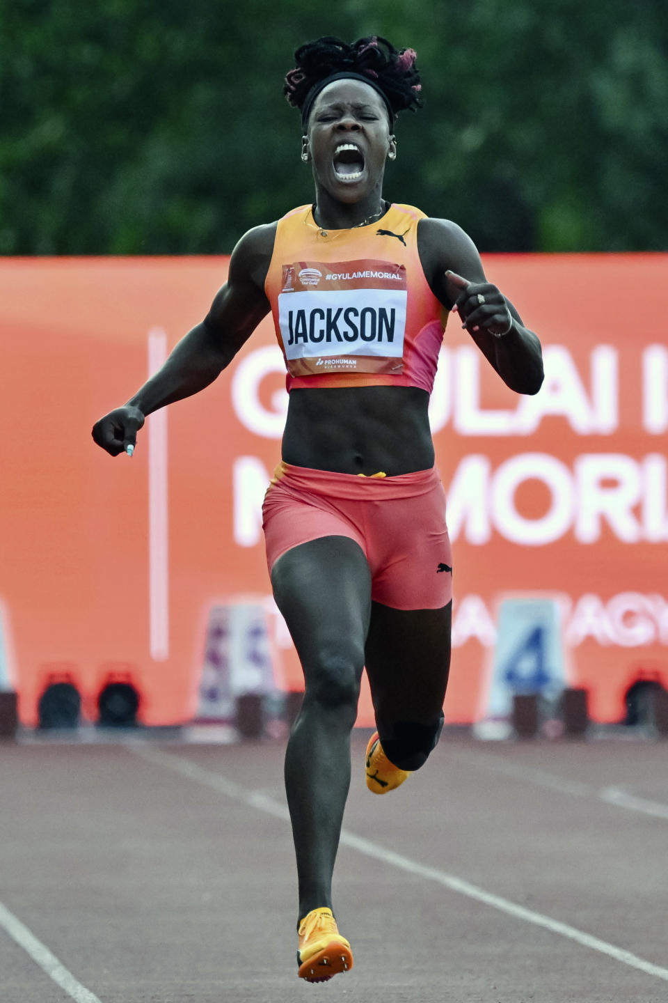 Shericka Jackson, of Jamaica, reacts to an injury during the women's 200 meter event at the Gyulai Istvan Memorial Track and Field Hungarian Grand Prix in Szekesfehervar, Hungary, Tuesday, July 9, 2024. (Tamas Vasvari/MTI via AP)