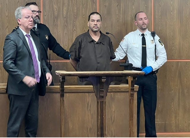 Orlando Garcia Rosado, dark shirt, in Fitchburg District Court on Wednesday.