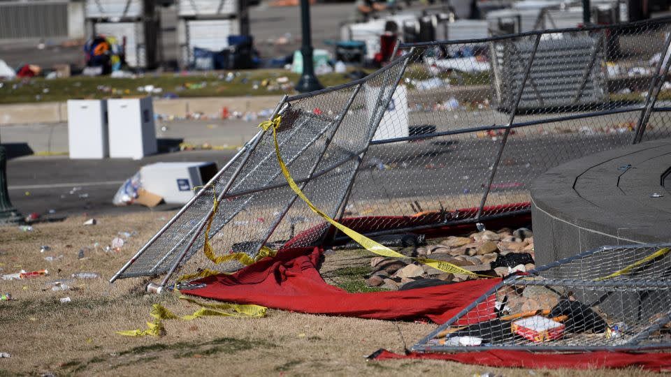 Metal fencing and trash are left at Union Station in Kansas City after gunfire erupted at victory rally. - Emmalee Reed/CNN