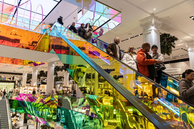 People shop on 5th Avenue in New York