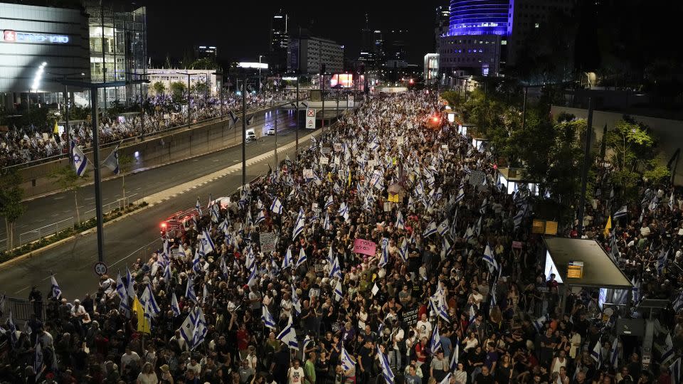 People protest against Netanyahu's government in Tel Aviv. - Leo Correa/AP