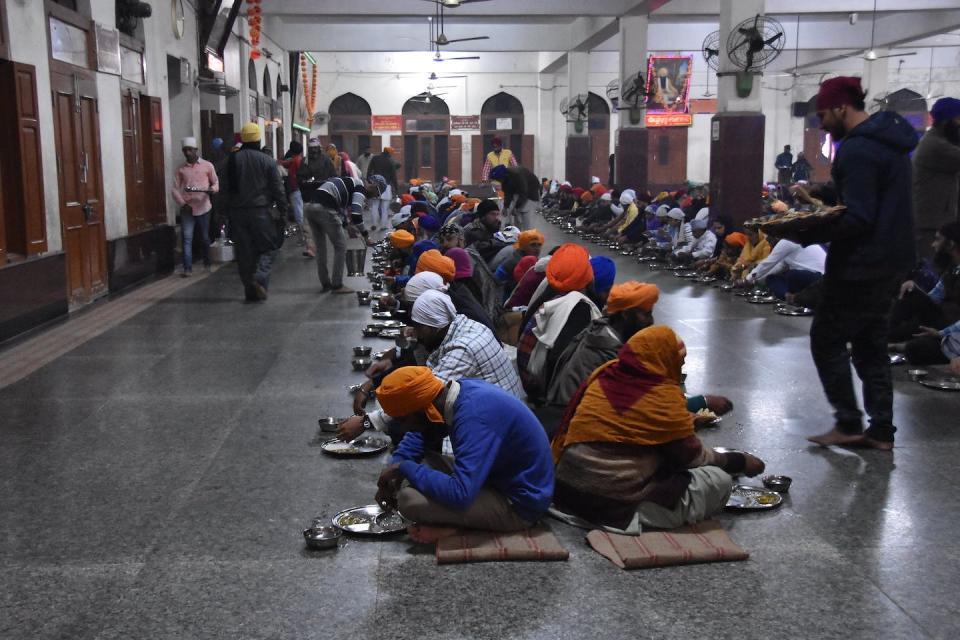 A community kitchen run by the Sikhs to provide free meals irrespective of caste, faith or religion, in the Golden Temple in Punjab, India. <a href="https://www.flickr.com/photos/shankaronline/38938496121" rel="nofollow noopener" target="_blank" data-ylk="slk:shankar s.;elm:context_link;itc:0;sec:content-canvas" class="link ">shankar s.</a>, <a href="http://creativecommons.org/licenses/by/4.0/" rel="nofollow noopener" target="_blank" data-ylk="slk:CC BY;elm:context_link;itc:0;sec:content-canvas" class="link ">CC BY</a>