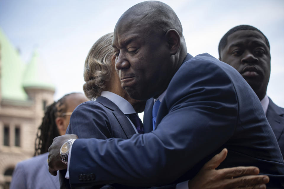 Attorney Ben Crump hugs Reverend Al Sharpton as he walks into the Hennepin County Government Center for the sentencing of former police officer Derek Chauvin on Friday, June 25, 2021 in Minneapolis. Chauvin is set to learn his fate as a Minnesota judge sentences him for murder in the death of George Floyd. (AP Photo/Christian Monterrosa)