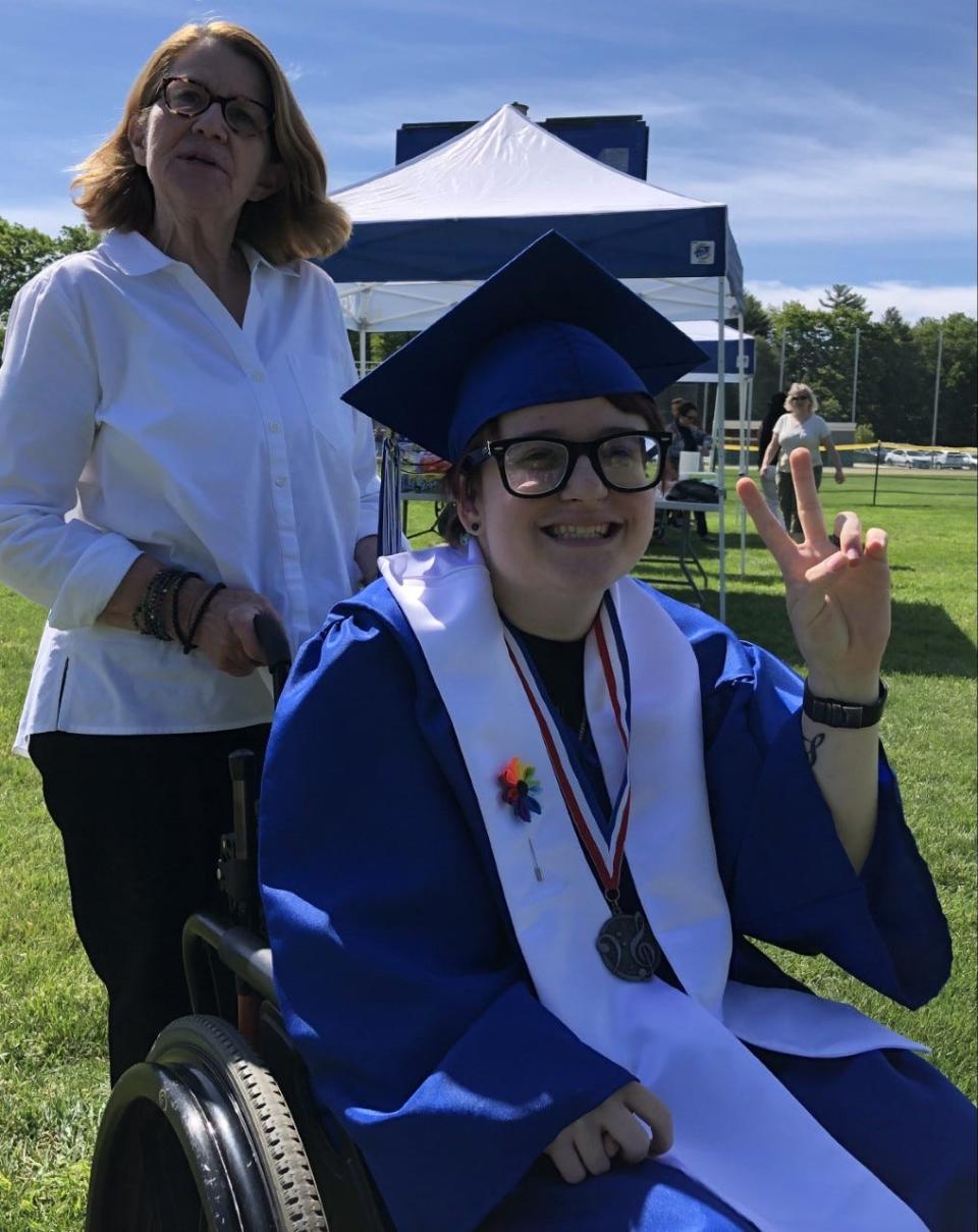 Graduate Jay Hostetter and teacher Beth Hazen are seen here moments before all the seniors of Kennebunk High School's Class of 2022 lined up for their commencement ceremony on Sunday, June 5, 2022.