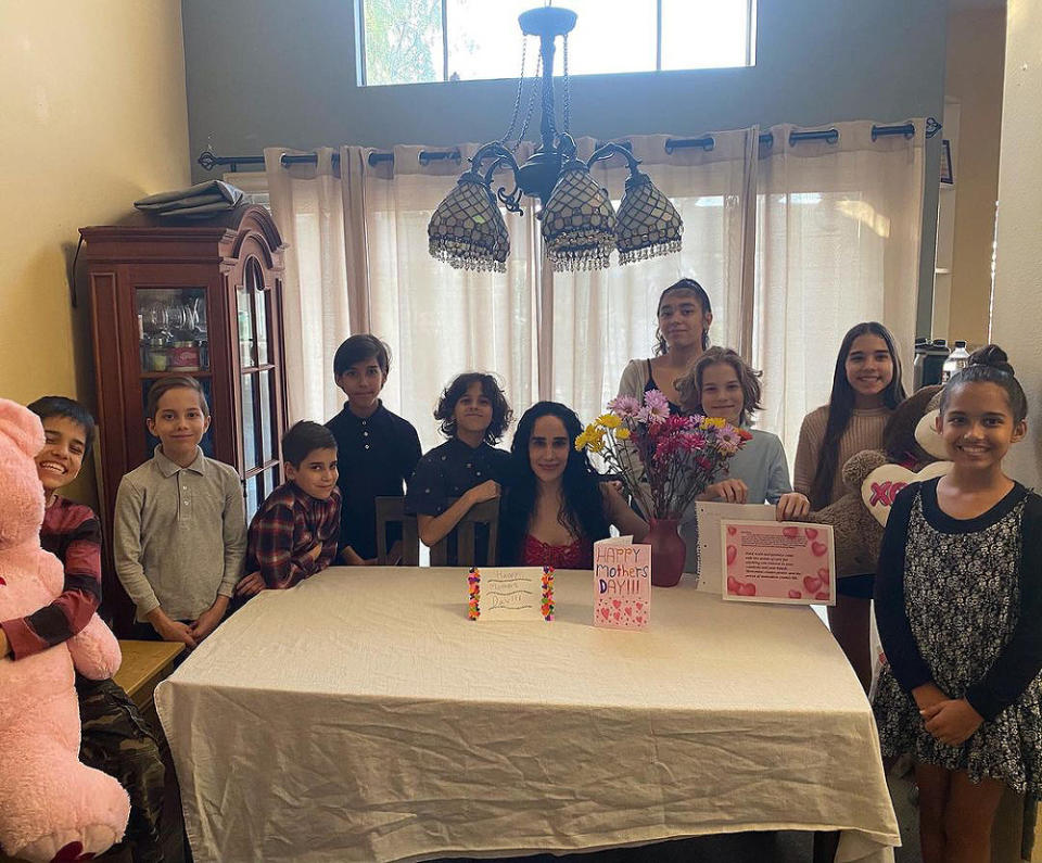 <p>On Mother's Day, 10 of 14 kids <a href="https://www.instagram.com/p/COrVhEKLSOw/?hl=en" rel="nofollow noopener" target="_blank" data-ylk="slk:posed for a photo;elm:context_link;itc:0;sec:content-canvas" class="link ">posed for a photo</a> alongside Suleman to celebrate her with cards, flowers and large stuffed animals.</p>