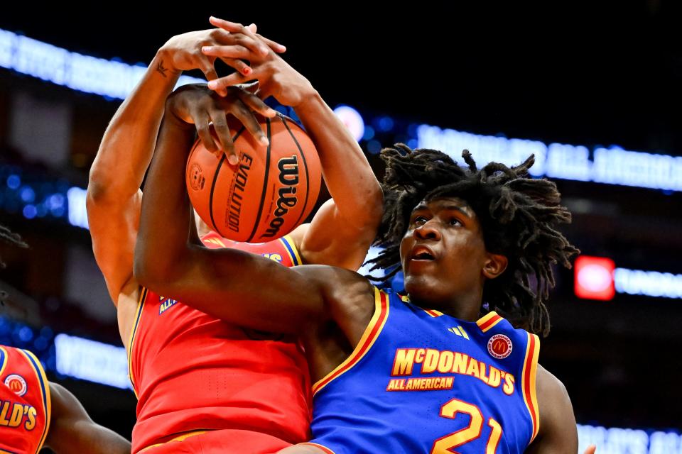 McDonald's All-American East forward Jayden Quaintance (21) grabs the rebound from under McDonald's All-American West forward Carter Bryant (9) during the first half at Toyota Center in Houston on April 2, 2024.