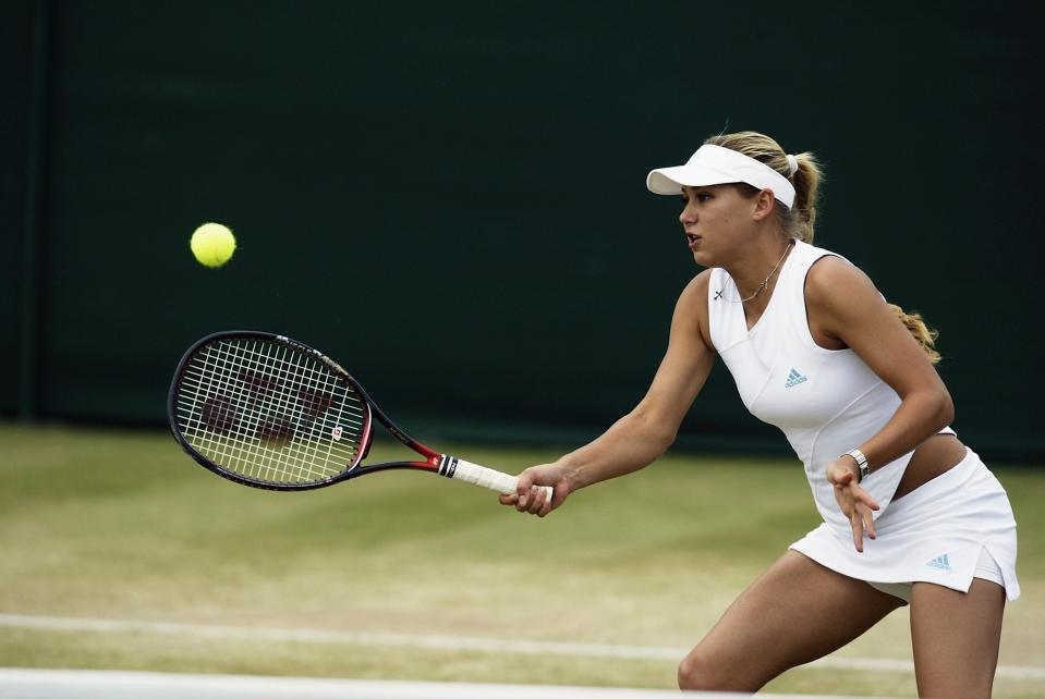 Anna Kournikova of Russia in action during the doubles match during the All England Tennis Championships at the All England Lawn Tennis Club, Wimbledon, England, on July 2, 2002