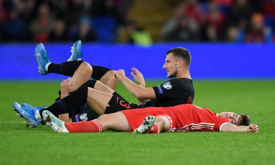 Dan James lying on the ground after being fouled.