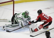 Dallas Stars goaltender Anton Khudobin (35) prevents Ottawa Senators left wing Anthony Duclair (10) from scoring on a breakaway during the third period of an NHL hockey game Sunday, Feb. 16, 2020, in Ottawa, Ontario. (Justin Tang/The Canadian Press via AP)