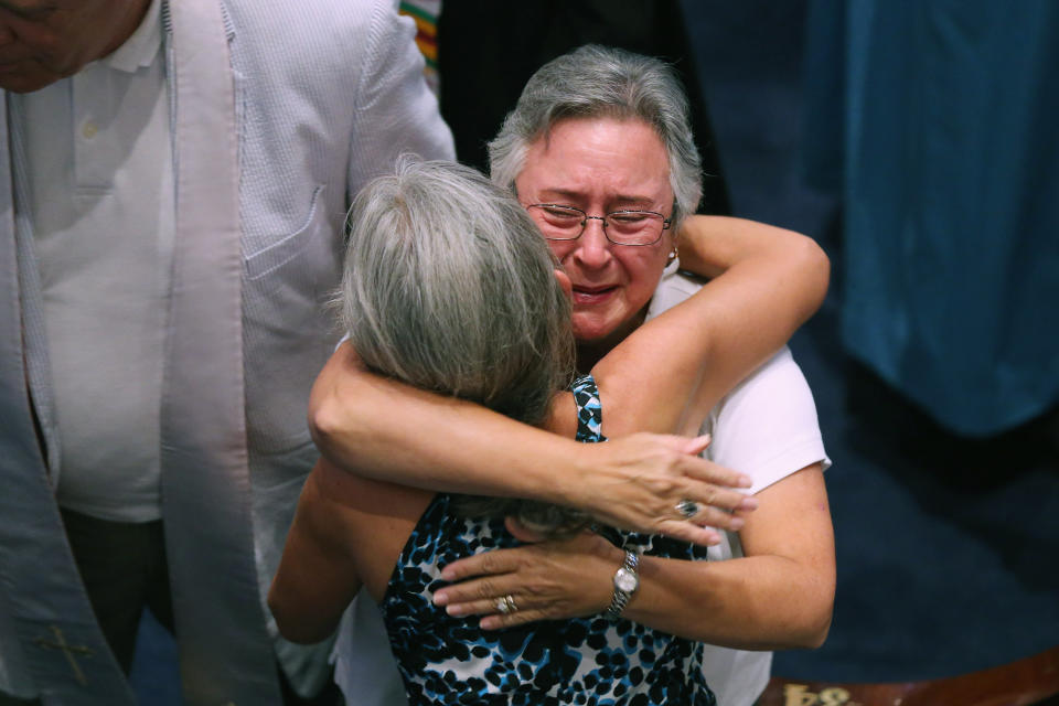 CHARLESTON, SC - JUNE 18:  Mourners gather for a community prayer service for the nine victims of last night's shooting at the historic Emanuel African Methodist Episcopal Church, at Second Presbyterian Church June 18, 2015 in Charleston, South Carolina. Dylann Storm Roof, 21, of Lexington, South Carolina, who allegedly attended a prayer meeting at the church for an hour before opening fire and killing three men and six women, was arrested today. Among the dead is the Rev. Clementa Pinckney, a state senator and a pastor at Emanuel AME, the oldest black congregation in America south of Baltimore, according to the National Park Service.  (Photo by Chip Somodevilla/Getty Images)