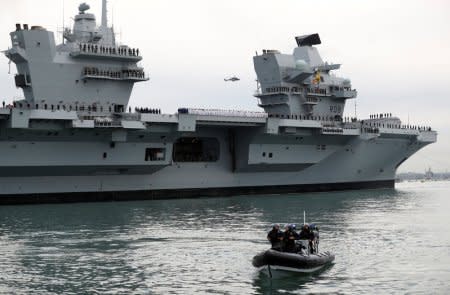 The Royal Navy's new aircraft carrier HMS Queen Elizabeth arrives in Portsmouth, Britain August 16, 2017. REUTERS/Peter Nicholls