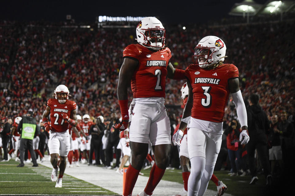 Louisville's Quincy Riley (3) and Jarvis Brownlee, Jr. (2) celebrate after a play during the Cardinals' win over Notre Dame on Oct. 7. (Michael Allio/Icon Sportswire via Getty Images)