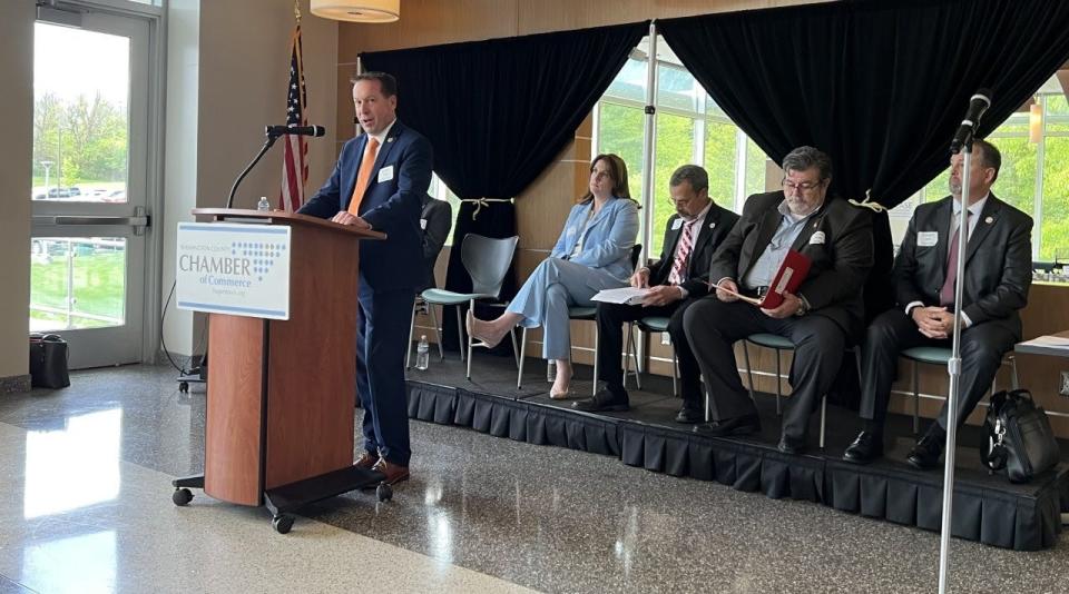 State Sen. Paul Corderman, R-Washington, at lectern, speaks at the post-legislative session forum at Hagerstown Community College on May 3, 2023. From left to right, Del. Terry Baker, R-Allegany/Washington, far left, behind Corderman, Del. Brooke Grossman, D-Washington, Del. William Wivell, R-Washington/Frederick, Sen. Mike McKay, R-Garrett/Allegany/Washington and Del. William Valentine, R-Washington/Frederick sit on the stage.