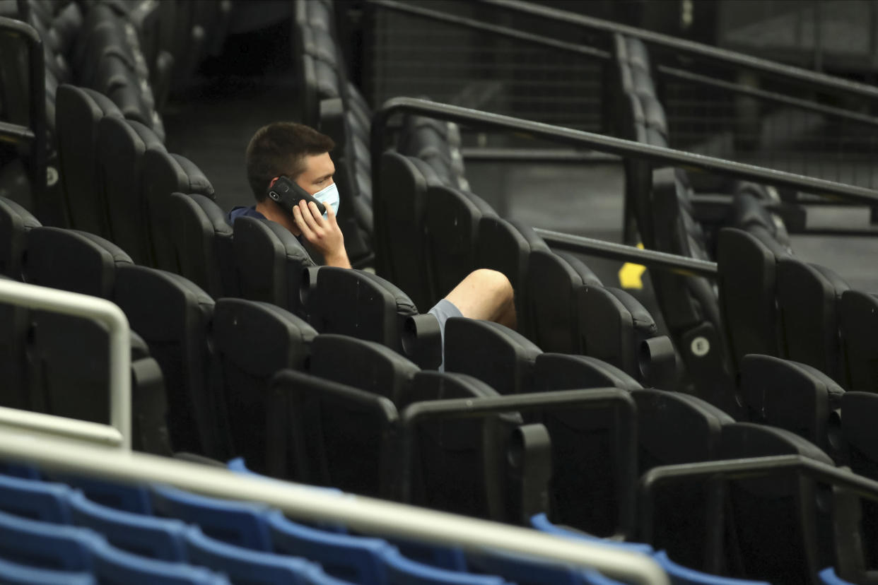 Tampa Bay Rays general manager Erik Neander watches baseball practice, Wednesday, July 8, 2020, in St. Petersburg, Fla. (AP Photo/Mike Carlson)