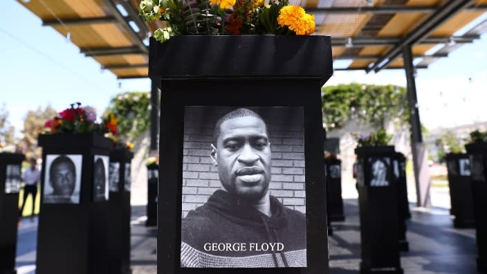 A photograph of George Floyd is displayed with others in the “Say Their Names” exhibit that opened in San Diego, California, in 2021. The memorial will open in New York this month in an area of Central Park notable in Black history. It features 200 Black Americans who lost their lives due to systemic racism and racial injustice. (Photo: Mario Tama/Getty Images)