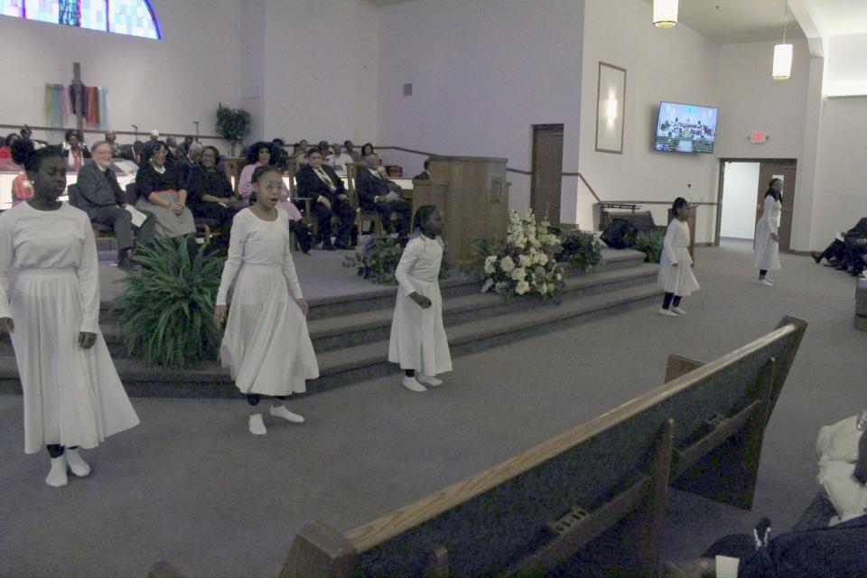 Praise Dance team Jesus Jewels from Shiloh Baptist Church performs at Mansfield Interdenominational Ministerial Alliance's ceremony honoring Dr. Martin Luther King, Jr. on Sunday at Maddox Memorial Church of God.