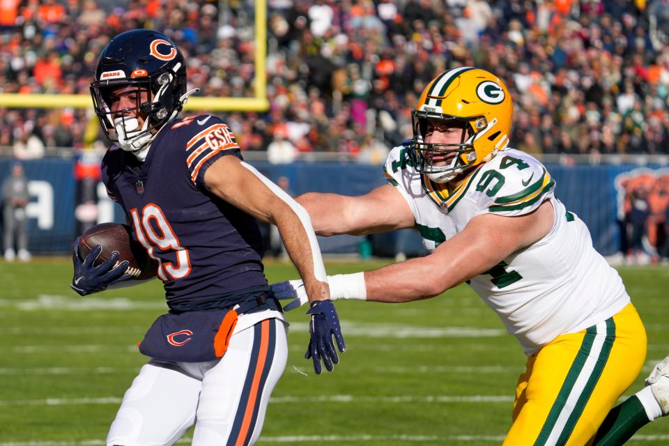 Chicago Bears' Equanimeous St. Brown is stopped by Green Bay Packers' Dean Lowry during the first half of an NFL football game Sunday, Dec. 4, 2022, in Chicago. (AP Photo/Nam Y. Huh)