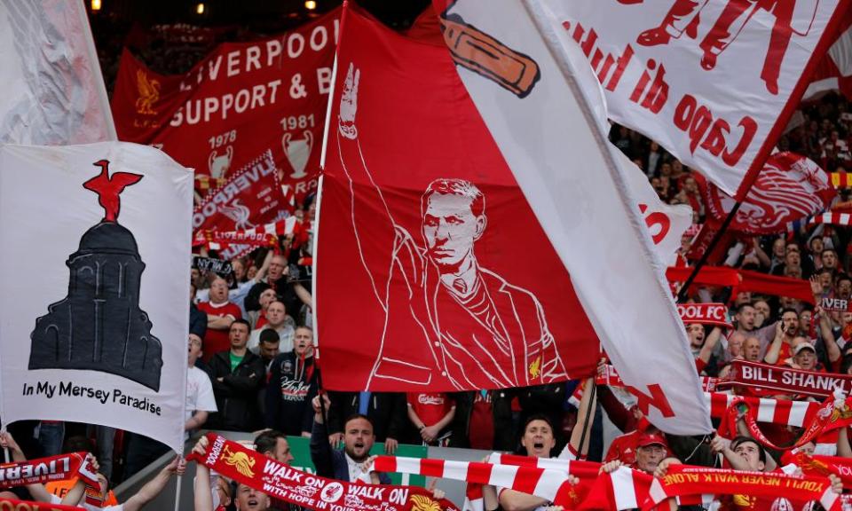 A flag showing Brendan Rodgers is waved on the Kop during Liverpool’s defeat by Chelsea on 27 April 2014