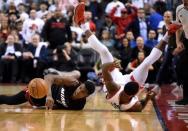 May 3, 2016; Toronto, Ontario, CAN; Miami Heat guard Josh Richardson (0) chases a loose ball with Toronto Raptors guard Terrence Ross (32) in game one of the second round of the NBA Playoffs at Air Canada Centre. Mandatory Credit: Dan Hamilton-USA TODAY Sports