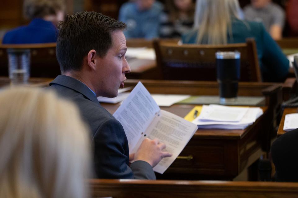 Sen. Chase Blasi, R-Wichita, looks over the Senate Calender during session Wednesday at the Statehouse.