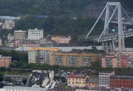 The collapsed Morandi Bridge is seen in the Italian port city of Genoa August 14, 2018. REUTERS/Stringer