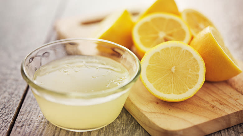 Halved lemons and juice