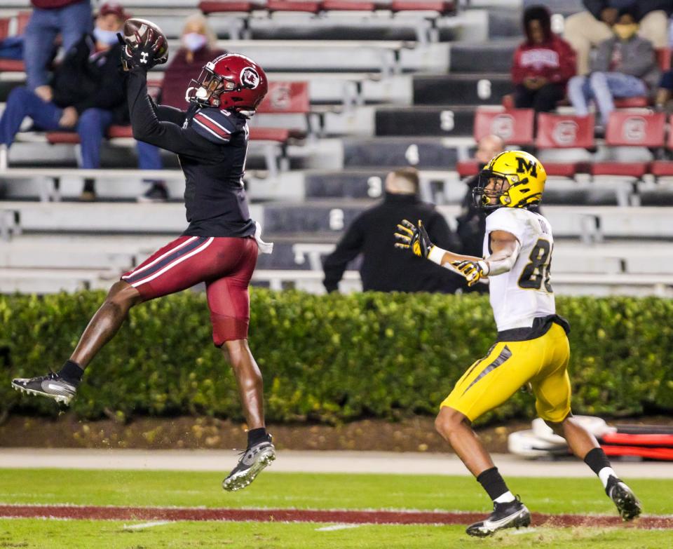 South Carolina Gamecocks defensive back Cam Smith (left) intercepts a pass intended for Missouri Tigers wide receiver Tauskie Dove (86) in the second quarter at Williams-Brice Stadium in Columbia on Nov. 21, 2020.