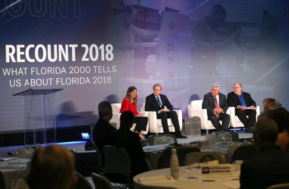 In this file photo from Nov. 14, 2018, Miami Herald editor, Amy Driscoll, left, leads the conversation with the “Recount 2018” panelists Kendall Coffey, attorney for the 2000 Gore Legal Team, Ed Pozzuoli, 2000 Bush Legal Team, and Mark Seibel, former Miami Herald editor during the 2000 Presidential Election as they shared their thoughts inside the Donna E. Shalala Student Center at University of Miami’s Coral Gables campus regarding the 2000 recount impact on Florida.