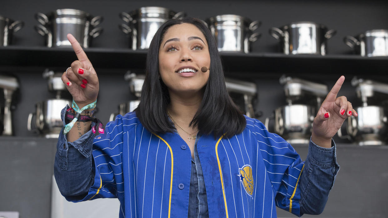 Napa, CA/USA: 5/26/17: Ayesha Curry interacts with the crowd at the culinary stage during BottleRock in Napa, California.