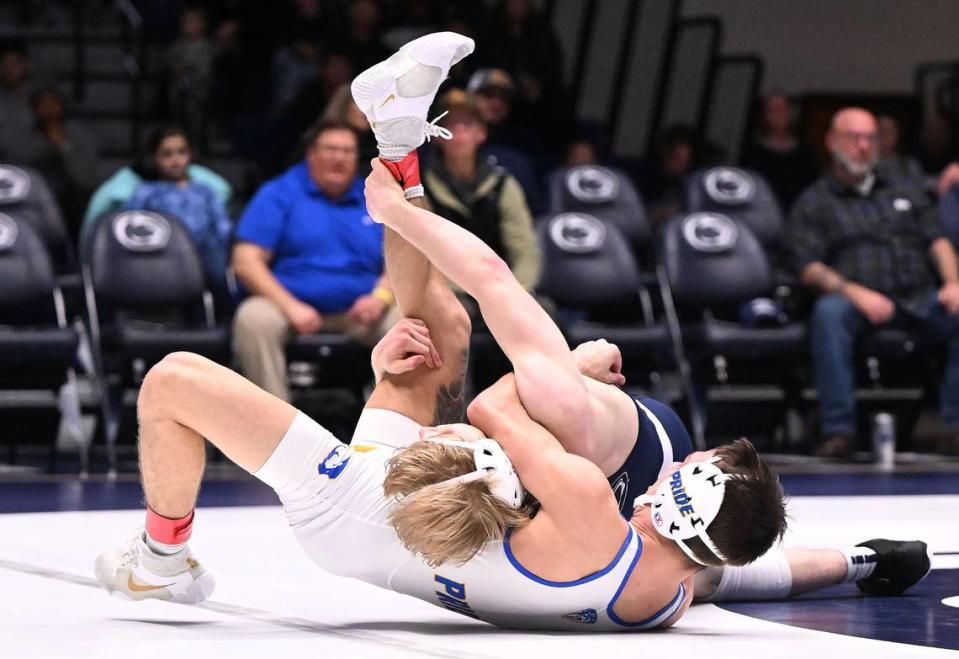 Penn State’s Braeden Davis (top) takes down Hofstra’s Dylan Acevedo (125 lbs) during the Dec. 10 match at Rec Hall. Davis defeated Acevedo, 11-2.