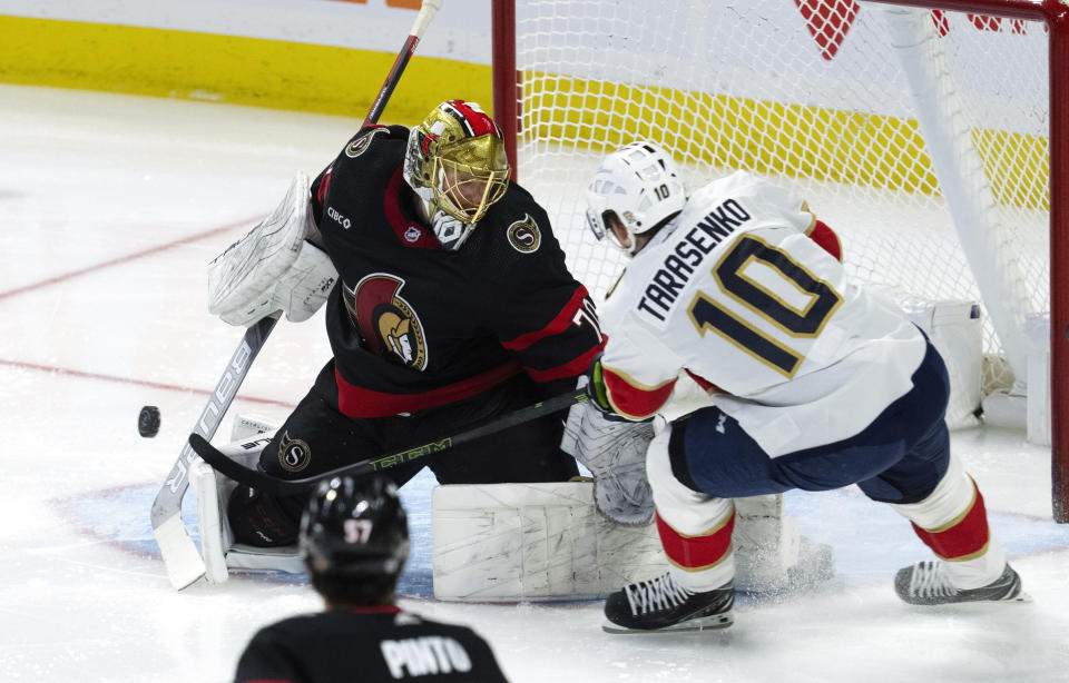 Florida Panthers right wing Vladimir Tarasenko tries to put the puck past Ottawa Senators goaltender Joonas Korpisalo during the first period of an NHL hockey game Thursday, April 4, 2024, in Ottawa, Ontario. (Adrian Wyld/The Canadian Press via AP)