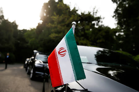 Cars of the Iranian delegation are parked outside a building of the at Diaoyutai state guesthouse in Beijing as Iranian Foreign Minister Mohammad Javad Zarif meets Chinese State Councillor and Foreign Minister Wang Yi, China, May 13, 2018. REUTERS/Thomas Peter
