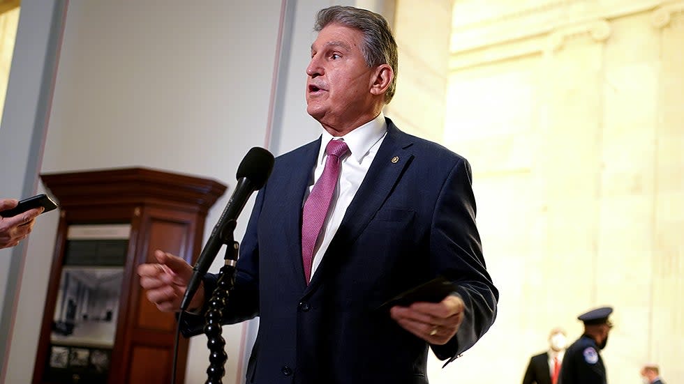 Sen. Joe Manchin (D-W.Va.) speaks to reporters after hearing from President Biden at a Democratic caucus luncheon at the Senate Russell Office building to discuss voting rights and filibuster reform on Thursday, January 13, 2022.