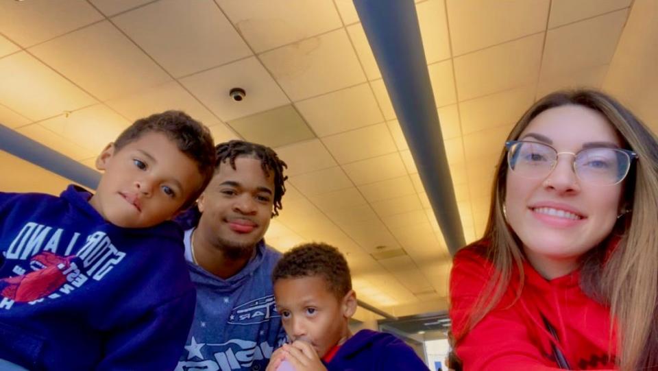 Tariq Massenburg, his girlfriend Kayla Prokopowich and their 4-year-old twins Kyzer, left, and Kashton.