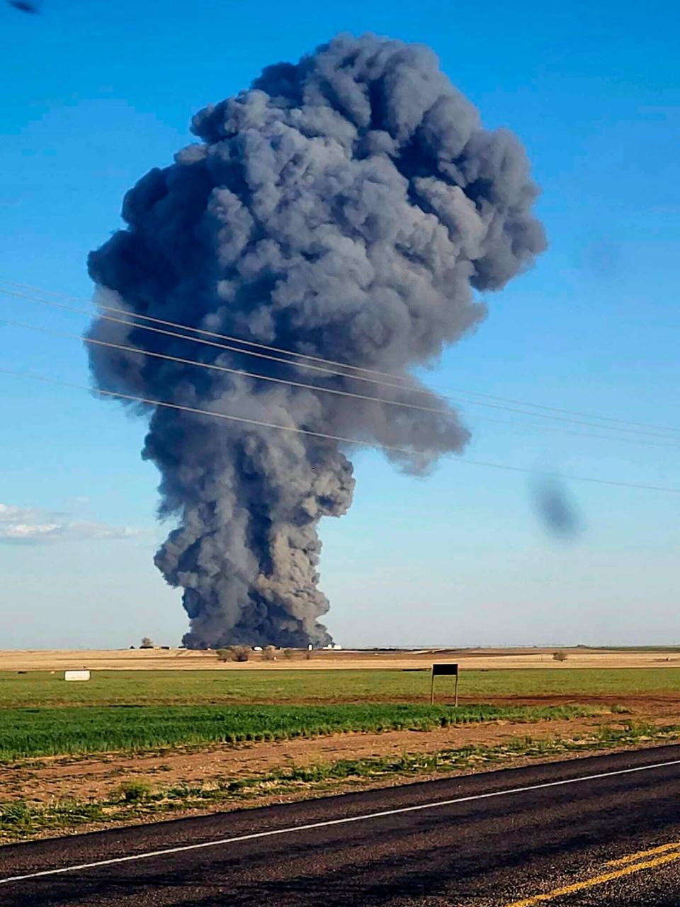 Smoke fills the sky after an explosion and fire at the Southfork Dairy Farms near Dimmitt, Texas, on Monday, April 10, 2023. The explosion at the dairy farm in the Texas Panhandle that critically injured one person and killed an estimated 18,000 head of cattle is the deadliest barn fire recorded since the Animal Welfare Institute began tracking the fires.