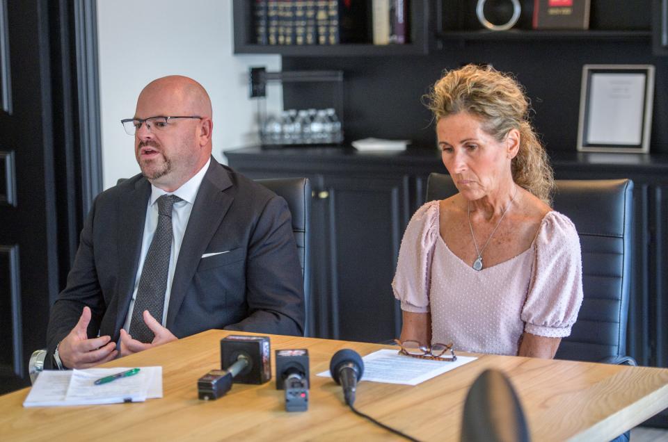 Attorney Jeff Green, left, and Deb Beaupre chat with local media about a lawsuit they've filed against Express Liquors on Western Avenue and Clayton Bell, the driver in a February 2022 drunk driving accident that killed Beaupre's teen daughter Mia Dusek, during a press conference Thursday, Aug. 10, 2023 at Green's law office in Peoria Heights.