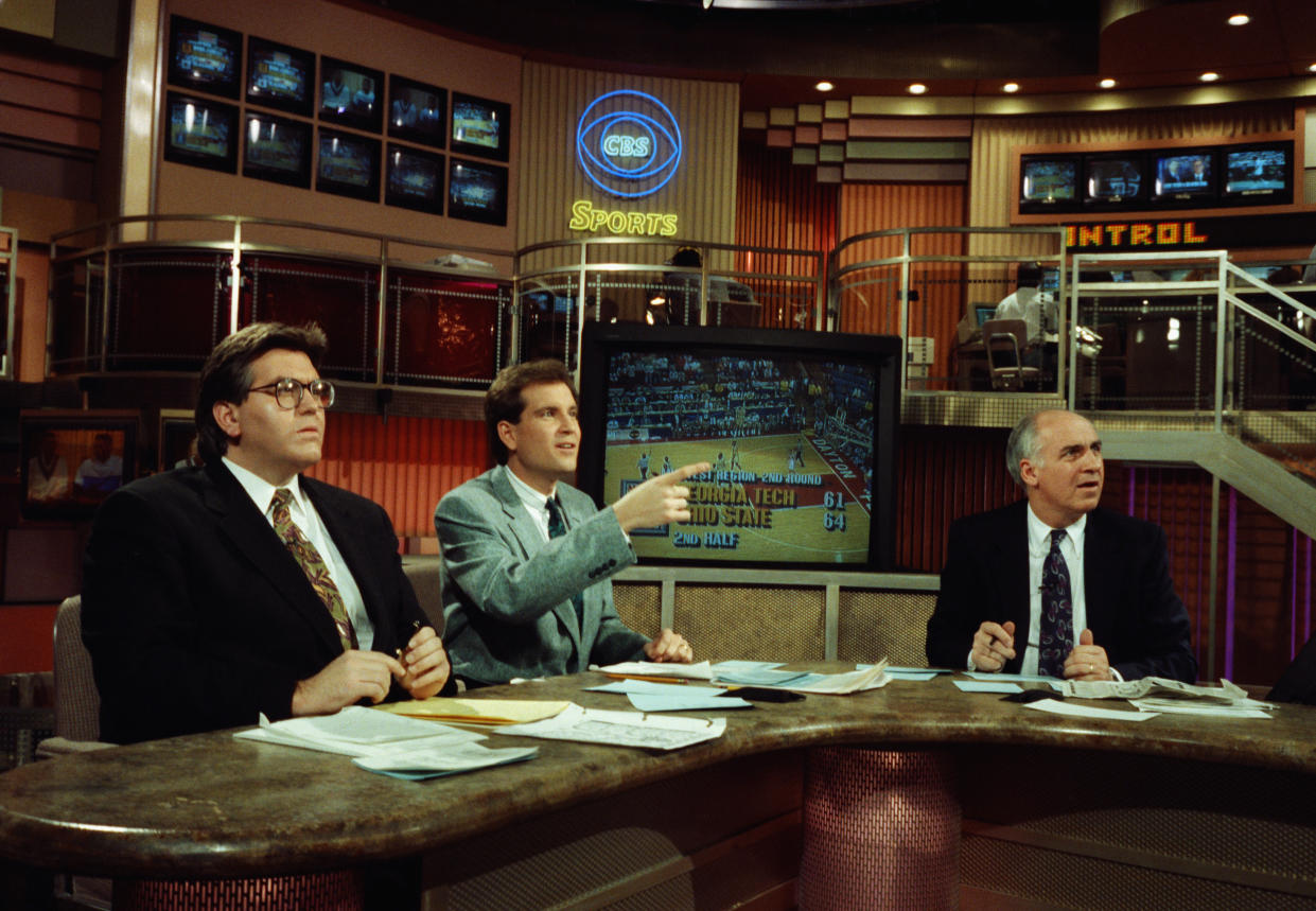 Jim Nantz (center) sits alongside Mike Francesa (left) and Billy Packer for a CBS studio show during coverage of the 1991 NCAA men's basketball tournament from their New York studios. (AP Photo/David Cantor)