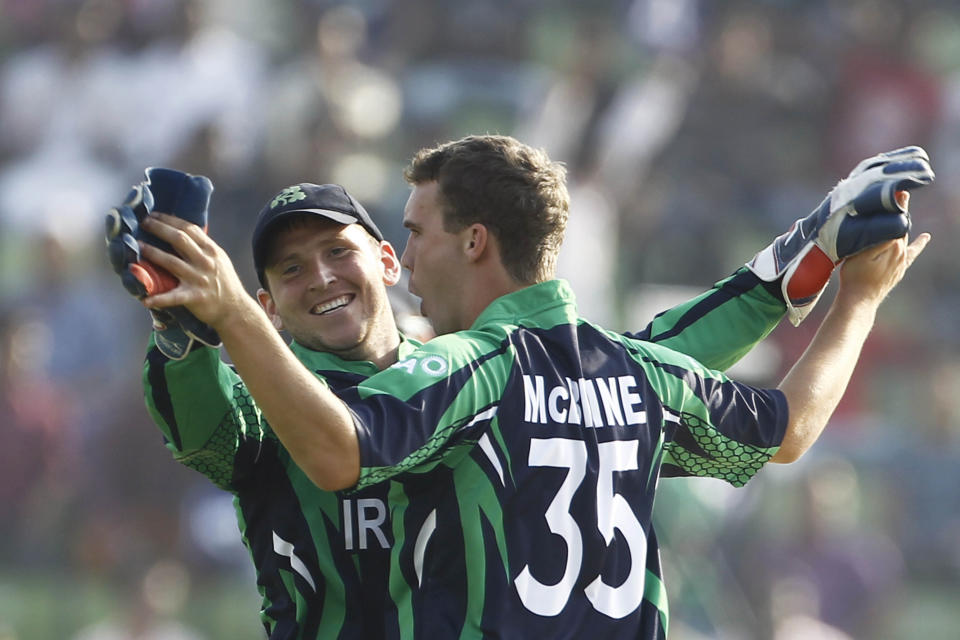 Ireland's Andy McBrine, right, celebrates with teammate Gary Wilson after taking the wicket of Zimbabwe's Sean Williams during their ICC Twenty20 Cricket World Cup match in Sylhet, Bangladesh, Monday, March 17, 2014. (AP Photo/A.M. Ahad)